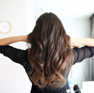 Close-up,Of,Woman,After,Visiting,Hairdresser.,Long,Curls,Of,Brunette